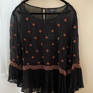 Women’s sheer bohemian style top.